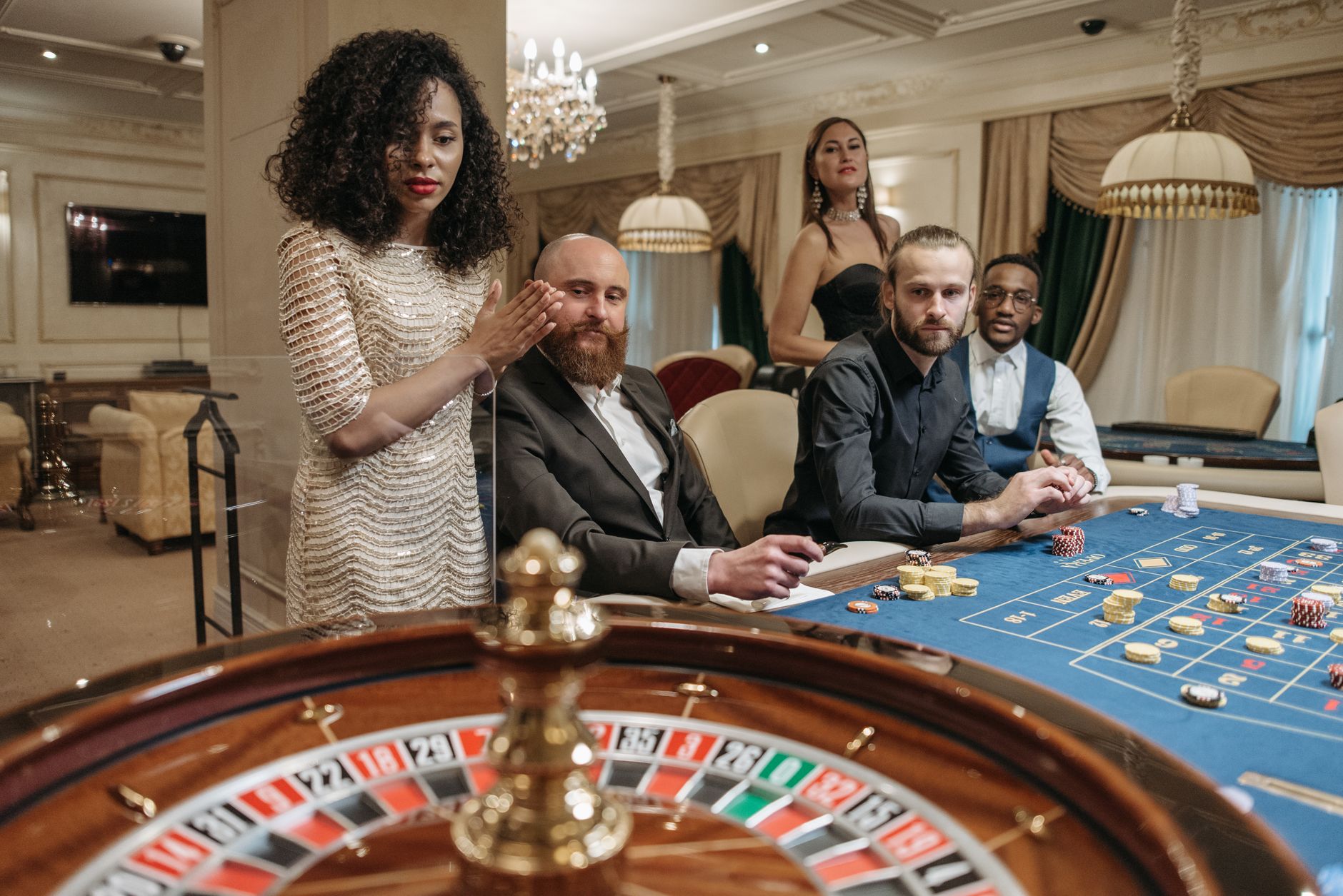 A group of people enjoying a night of roulette at a luxurious casino. — Casinos