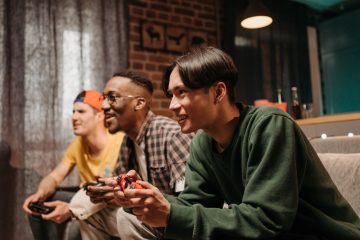 Diverse group of young adults enjoying video games together indoors, creating a fun and social atmosphere. — Cut Stack 150 mg