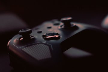 A close-up shot of a game controller in low light, highlighting its design and buttons. — Free Rotates & No Deposit