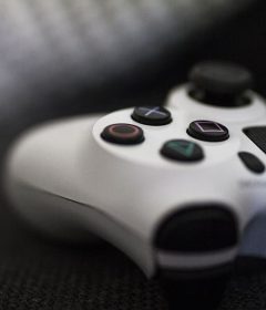 close-up of a gaming controller on a textured surface